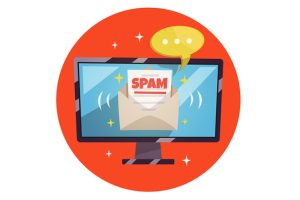 Spam email with a chat bubble above it on a computer monitor.