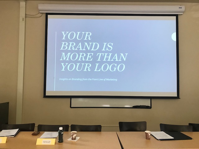 Slideshow and conference table at Clark University from our brand marketing workshop.