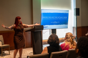 Julia Becker Collins posing in front of her SBE workshop "Making Paid Ads That Actually Work."