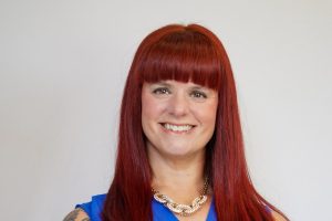 Headshot of Julia Becker Collins. Photo taken by Catrina Gardner.