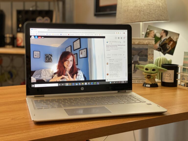 Vision Advertising COO Julia Becker Collins performing the Business Bootcamp Social Media webinar on the screen of a laptop on top of a desk