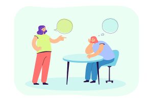 Two people, one of which is talking and the other is bored.