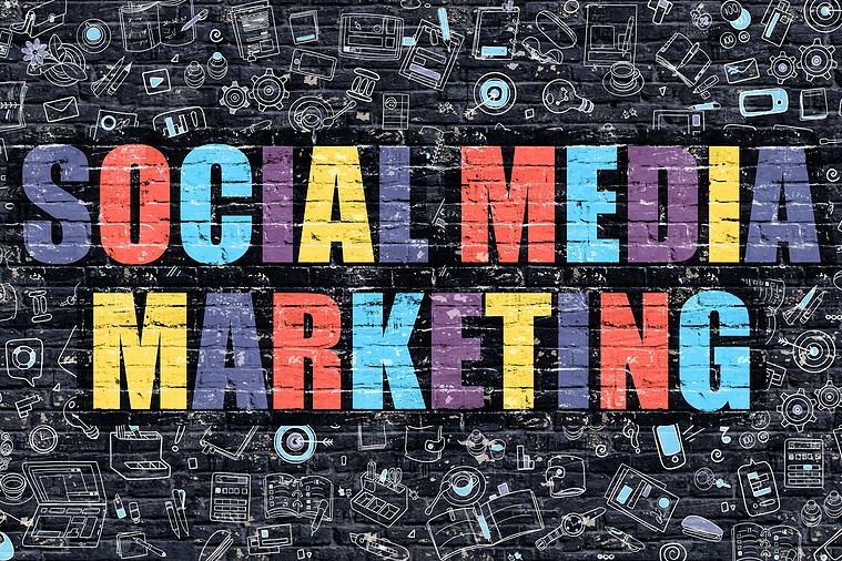 Social Media Marketing in colorful text on black brick background with marketing icons.