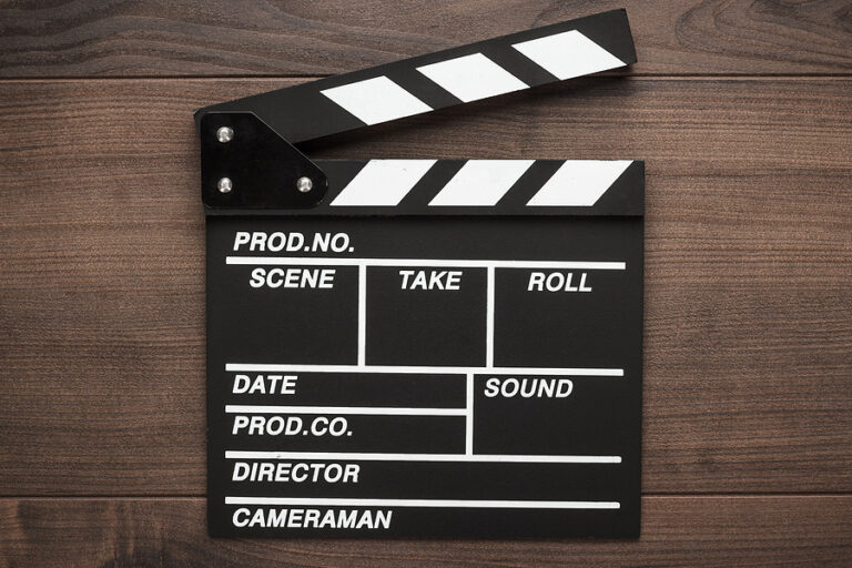 Clapper board on wood background.