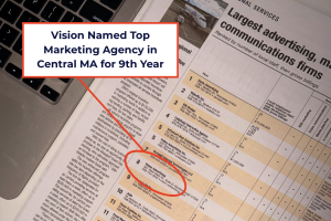 Highlighting entry in WBJ Book of Lists with text "Vision Named Top Marketing Agency in Central MA for 9th Year"