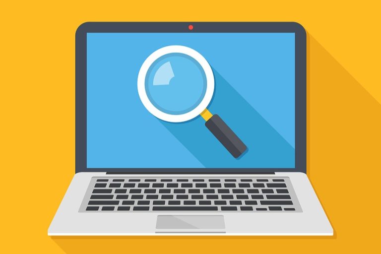 Magnifying glass on the screen on a laptop.