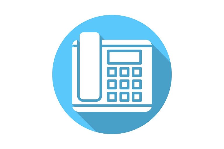 Closeup of an office phone in flat design.